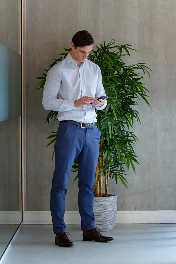 Erwin, co-founder of Go Ahead HiRe, reviewing a hiring brief on his phone in the Reutum office